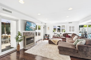 Living room surrounded by windows