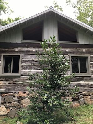 New windows in place. New roof structure with metal roofing.