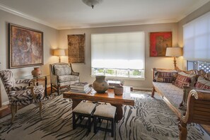 Living room has views of park and lots of natural light