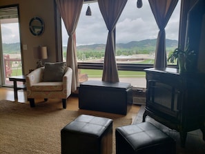 upstairs living room with view of surrounding hills