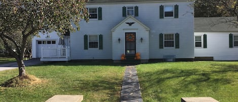 Front of House with stone wall entrance