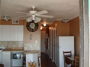 Kitchen area looking towards hall and bedroom