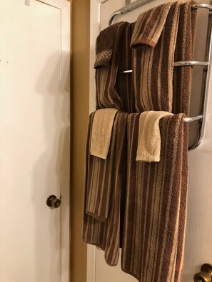 Bath area with six sets of towels