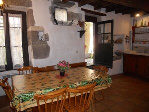 Kitchen dining opens into courtyard garden