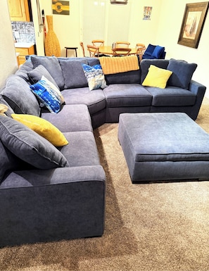 Comfy Living room with gas fire place and plenty of seating.