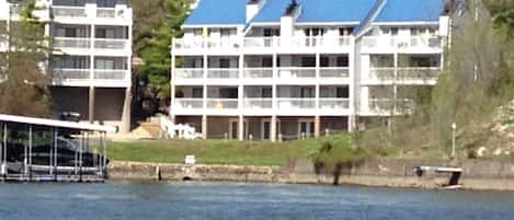 On the water directly! End building- very top floor middle unit - 40 foot deck!