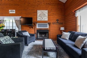 Cozy living room setting with brand new furniture and a wood burning fireplace