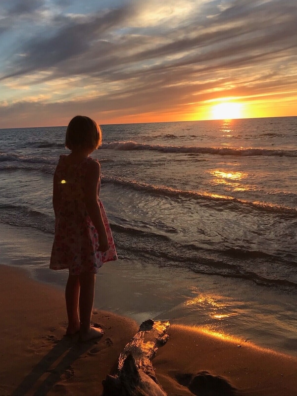Take photos of the sunset. Harbert Beach 5 block walk.