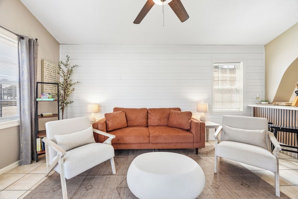 Enjoy your open space living room with cozy lights that set the perfect mood.