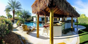 Adults love this backyard too.  Palapa next to the fire pit and pool.