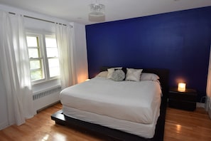 Bedroom view on the backyard with king size bed
