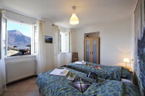 Bedroom 2 - comfortable twin beds with views of lake and mountains