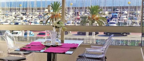 dining table with view to the Marina Port and the sea