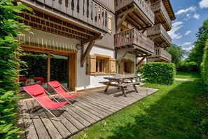 Sunny terrace with outdoor furniture    