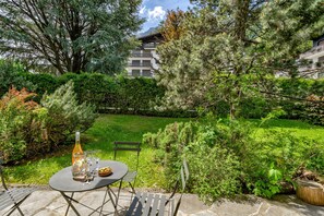 Stone terrace opening onto gardens 