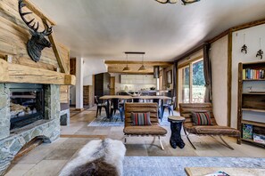 Open plan living area with log burner       