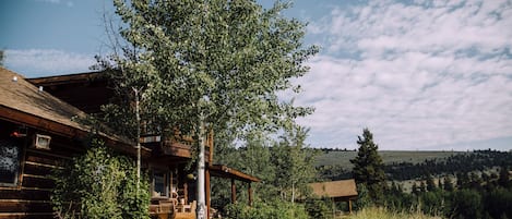 View of rear of main house with guest lodge in background