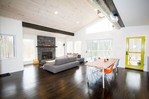 Living room with fireplace and two spacious, configurable sofas