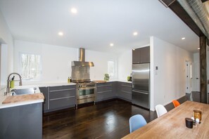 Fully stocked kitchen with top-of-the-line Bertazzoni, Bosch and Fisher & Paykel