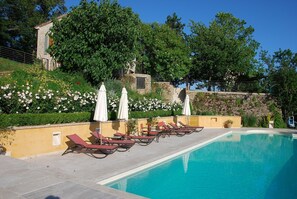 Pool in June: roses in full bloom