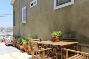 Directly outside the front door - outdoor dining table & chairs