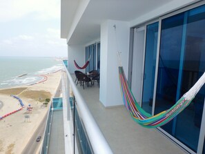 Balcony goes the length of the apt--2 hammocks, table & chairs, beachfront!