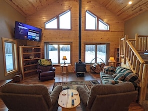 View of the front of the cabin. 65" tv with roku, soundbar, youtube TV.  