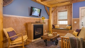 Living room with fireplace and Swedish reading nook