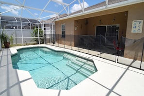 Beautiful south-facing pool with shaded lounge area, loungers, no rear neighbors