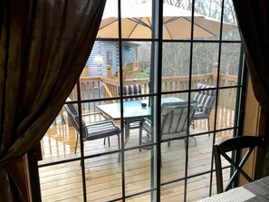 Back patio complete with dining, electric grill and beautiful lighting 