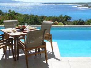 Lunch by the pool captivated by the view of the shimmering sea, St Marteen. 