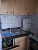 Küche mit Geschirrspüler und Waschmaschine im Ferienhaus "Zum Leuchtturm"