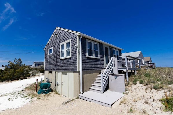 back of house with outdoor shower