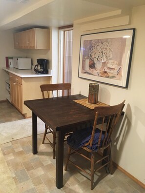 Kitchen, dining room is spacious and well furnished with full sized fridge 