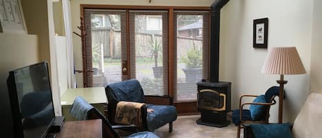 Quiet, bright airy living room, comfy seating, desk, TV,  skylights!