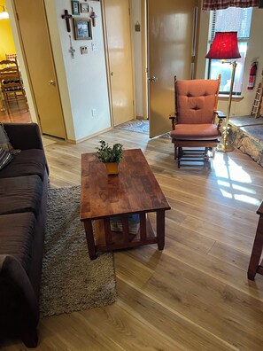 Living Room with Vinyl Flooring and area rugs