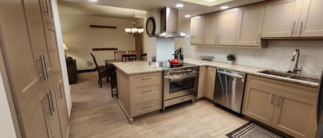 Kitchen:  Stainless appliances, granite counter-tops, fully stocked kitchen ware