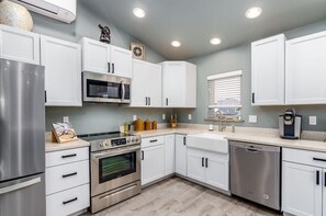 Expansive kitchen stocked with the essentials.  