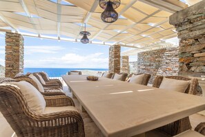 The outdoor dining area overlooking the pool
