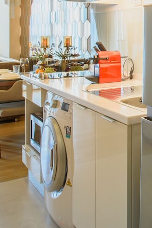 Kitchen – Modern with stone counters, kitchen appliances. 