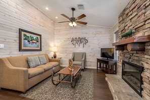 Take a seat in front of the fireplace and enjoy a movie in the living area.
