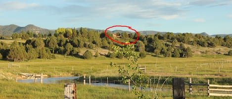 The Ranch House is hidden in the trees just left of the cabins in the red circle