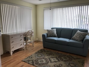 Full size sofa sleeper in sitting room for extra guests and a work station.