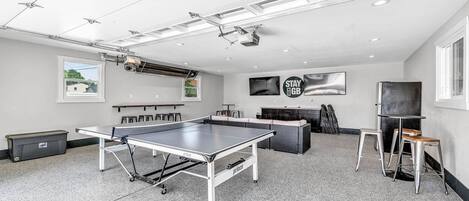 Entertainment Garage - Pair of 65" TV's, Fridge, Ping Pong, Seating, Heated, and Epoxy Floors.