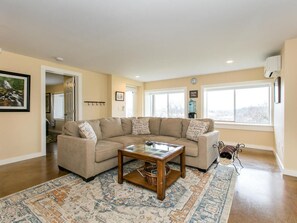 Relax in the Den/Living Area off of the Front Entry.  Plenty of natural light.