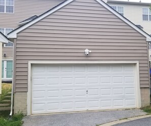 your own car garage right in front of your apartment door