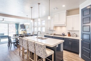 Kitchen Island - The Kitchen Island comfortably seats 4 adults and creates a great space for serving and preparing meals.