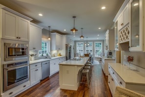 Gourmet kitchen is well lit and bright and sunny with lots of natural light. 