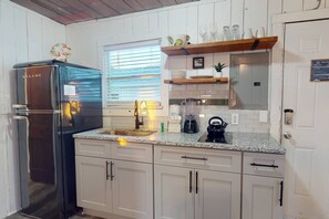 KITCHENETTE with Granite Countertops, Vintage Style Appliances, and a Dual Ceramic Stovetop