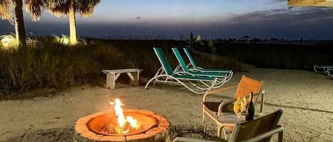 Shared fire-pit, tables, BBQ grills, plenty of loungers, and beach toys